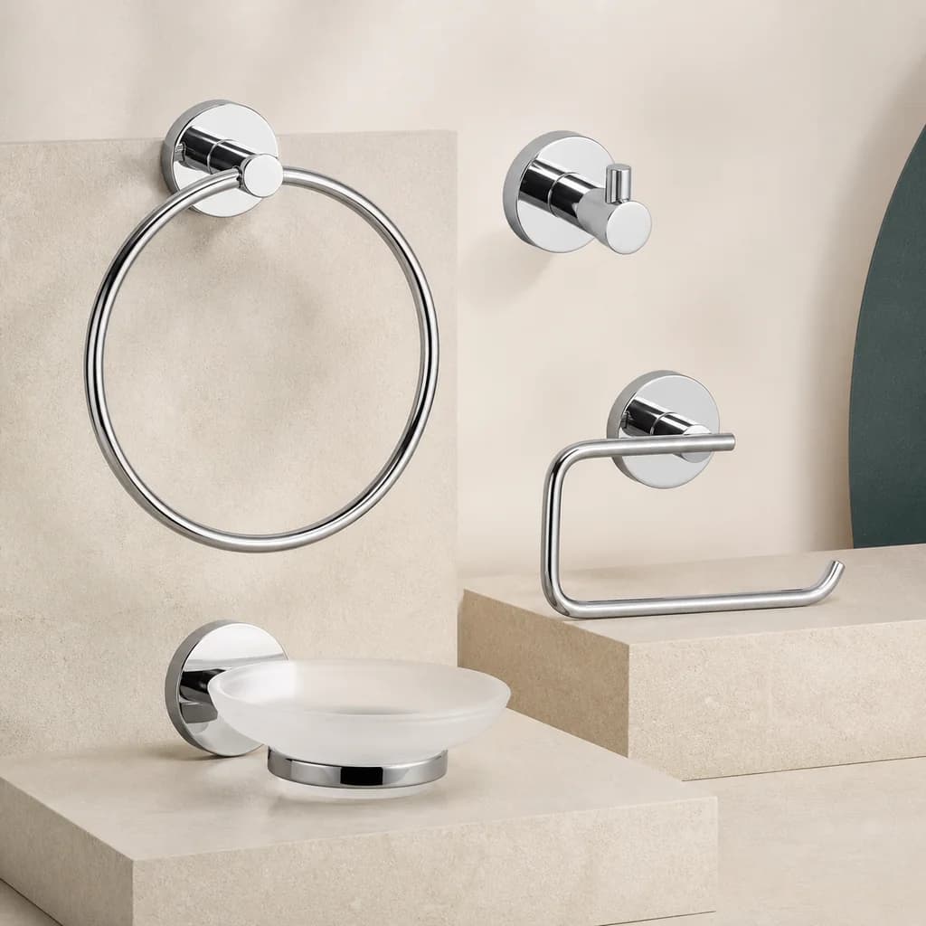 Representative studio image of a four-piece chrome bathroom accessory set